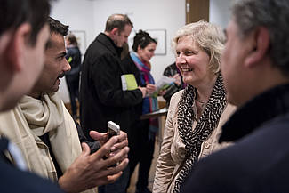 Artist Waseem Ahmed and curator Martina Stoye talking to visitors, photo: Sebastian Bolesch